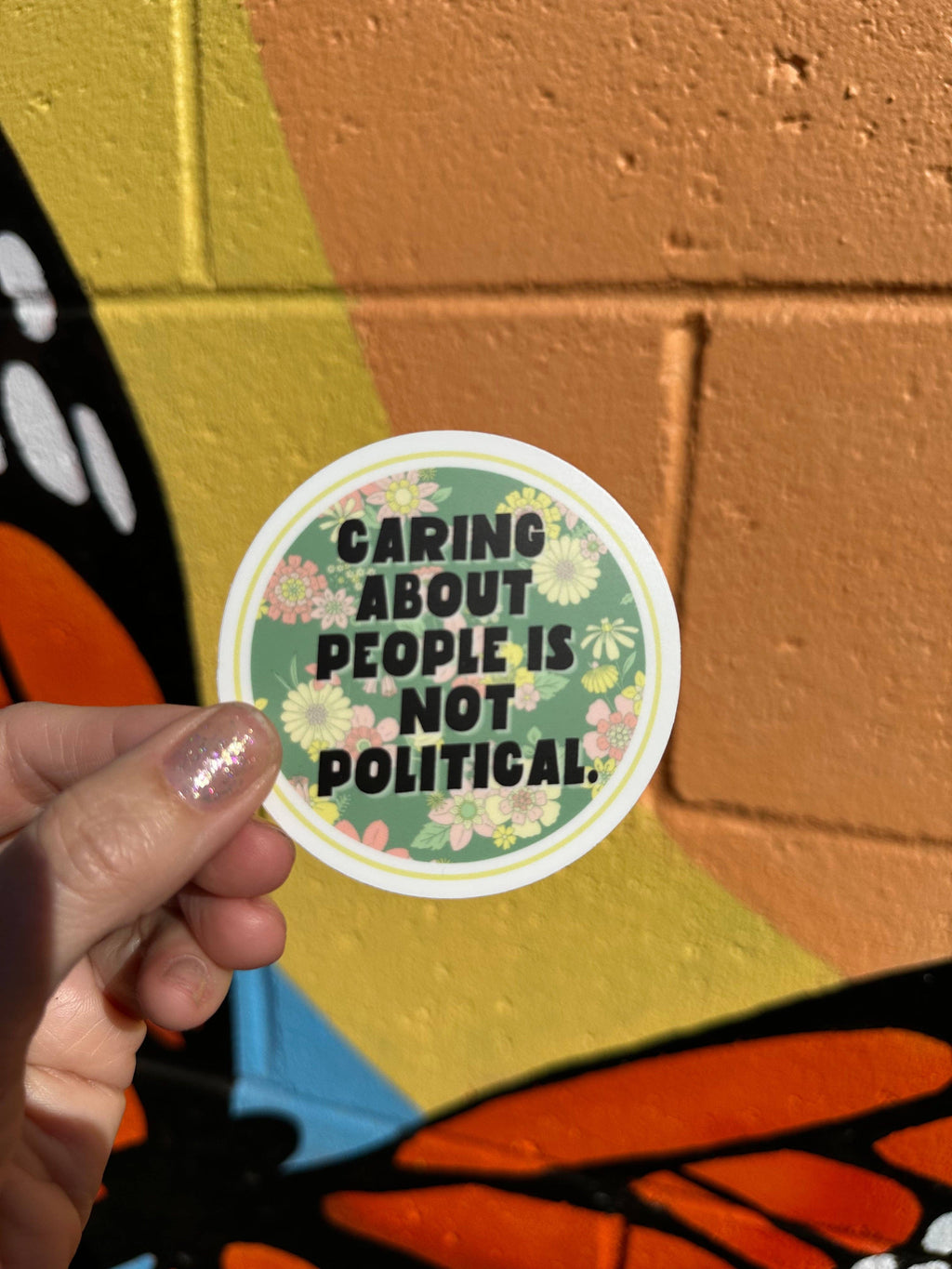 Hilarious Humanitarian - Caring About People Is Not Political Sticker