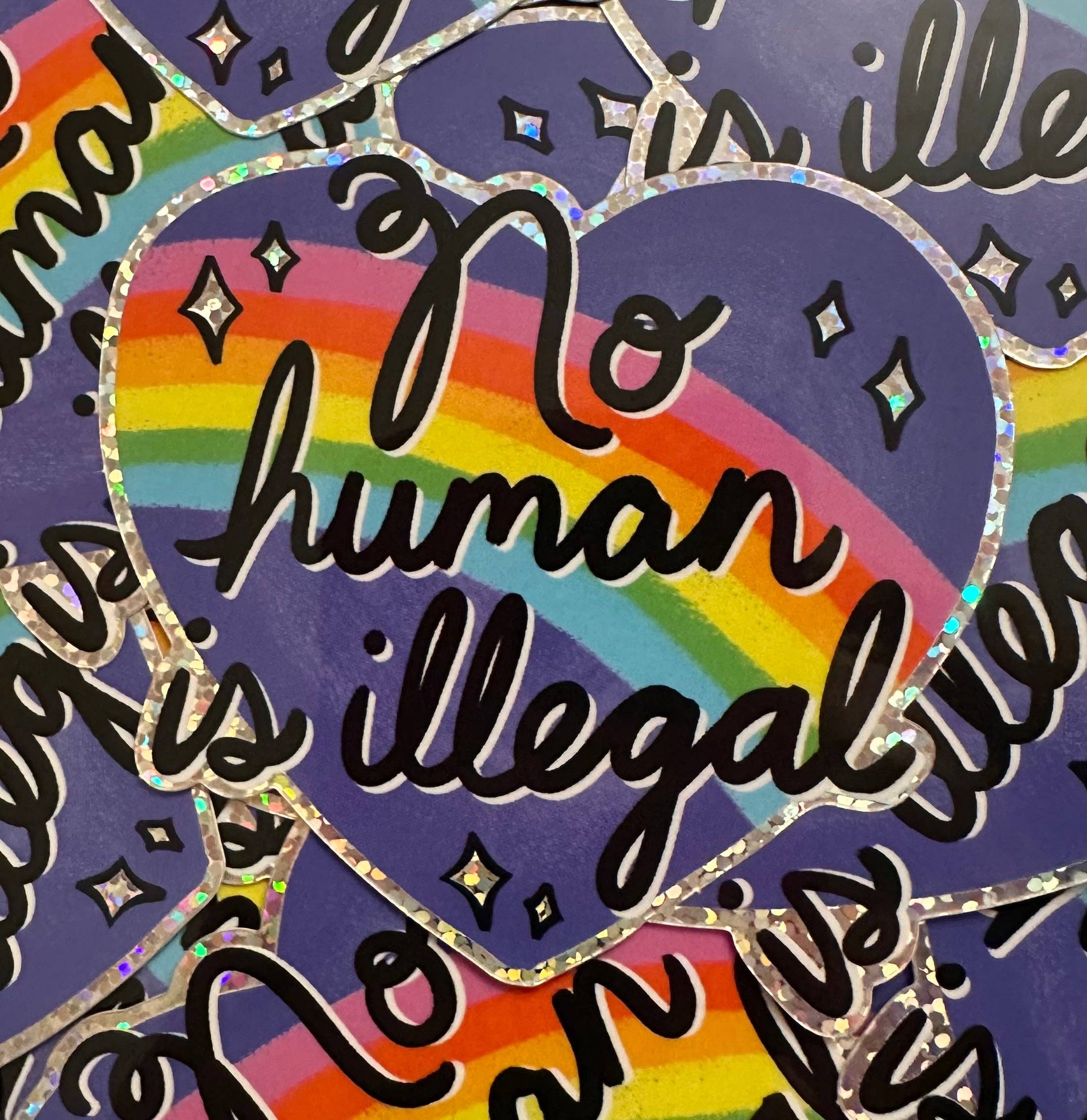 Hilarious Humanitarian - No Human Is Illegal Glitter Sticker